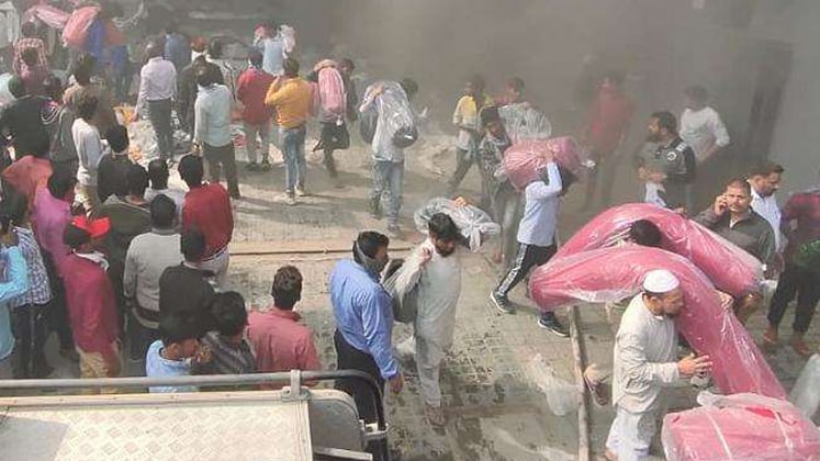 Workers saving fabric during the fire